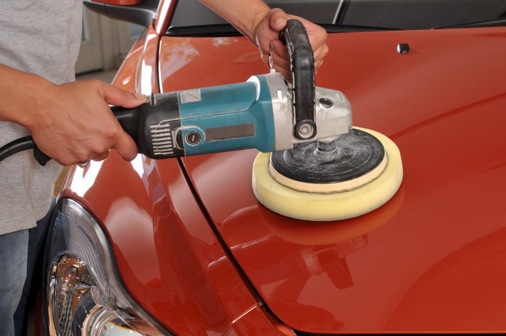 Sponge Car - A Man Waxing the Front of the Car