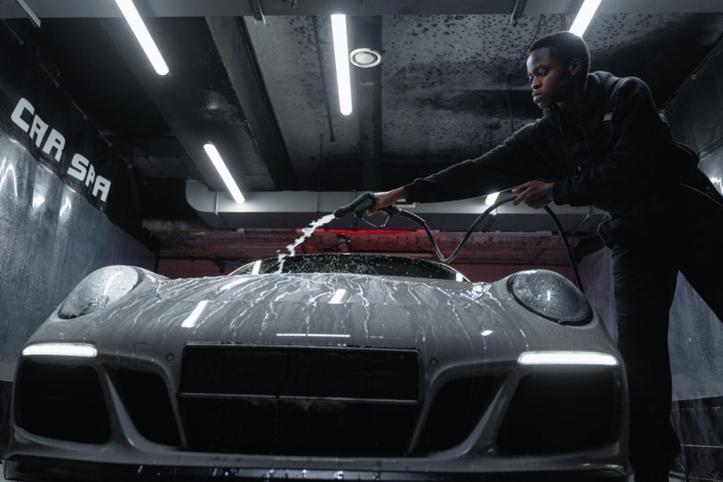 Sponge Car - A Man Body Washing the Front Part of the Car